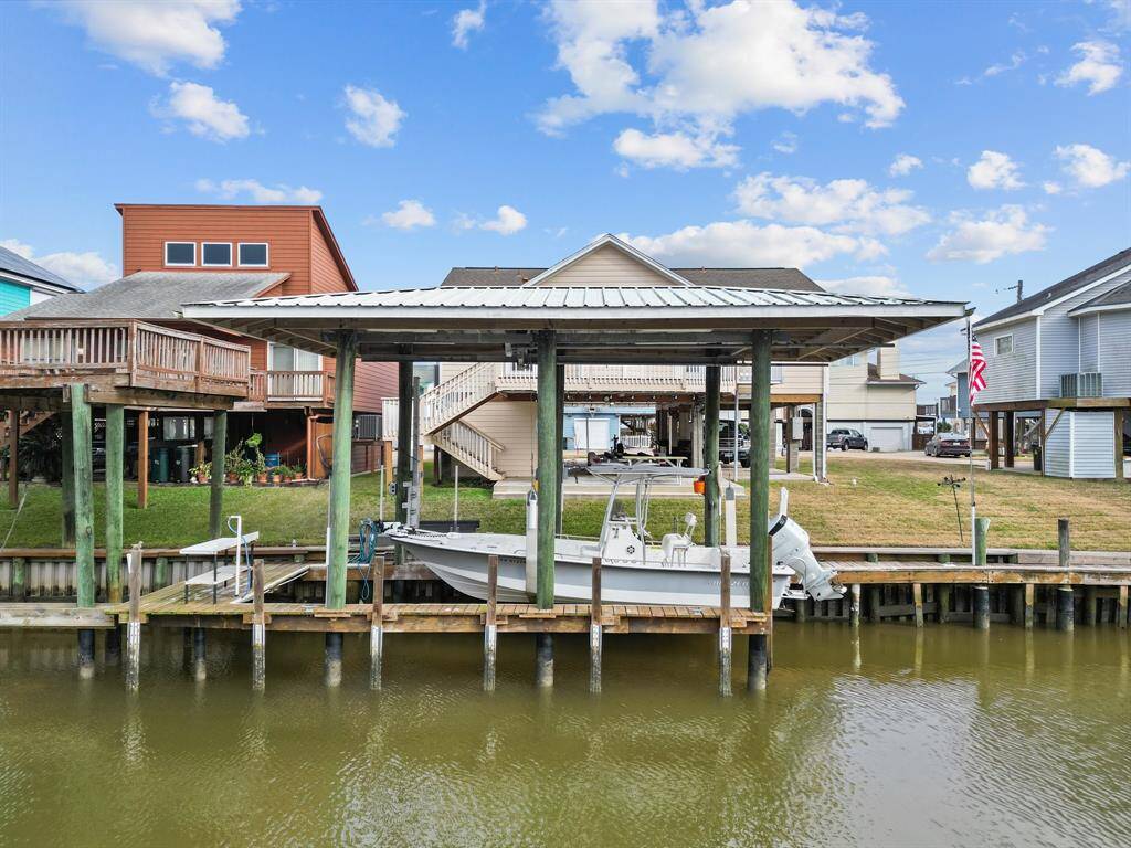 A look at the back of the house, boat house and lift. Catch your fish and clean them right outside!