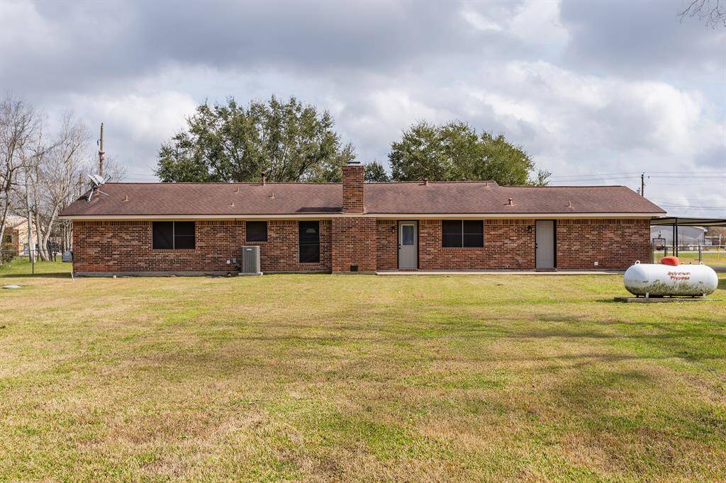 Expansive fenced backyard offers privacy and space for outdoor enjoyment.