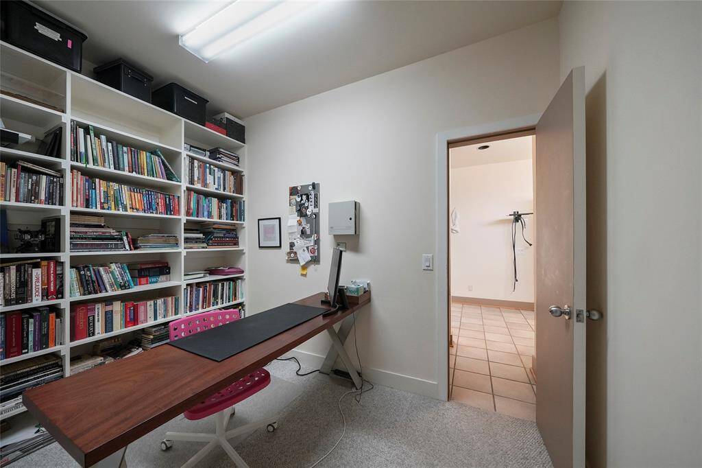 Office space between primary bedroom and guest suite with full kitchen