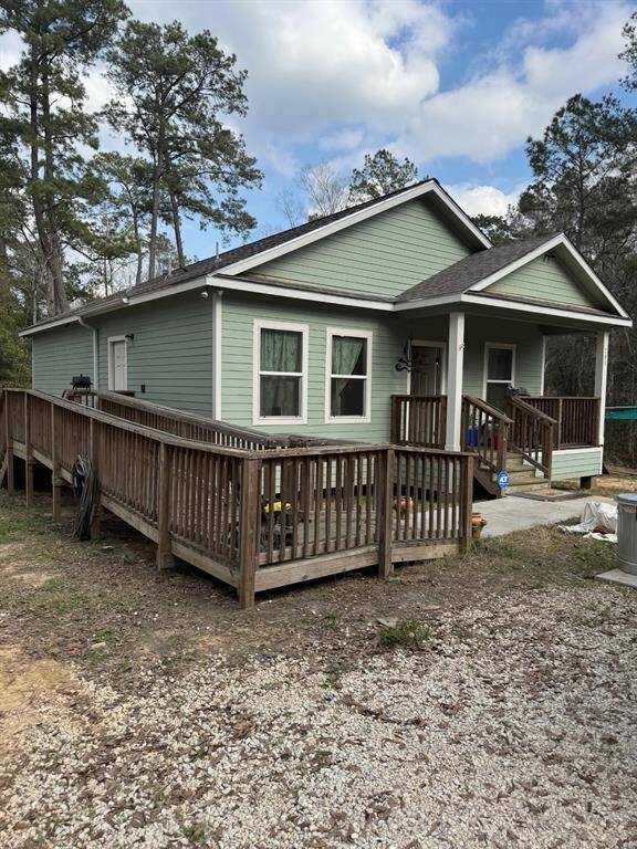 Wheelchair ramp attached to back door of home.