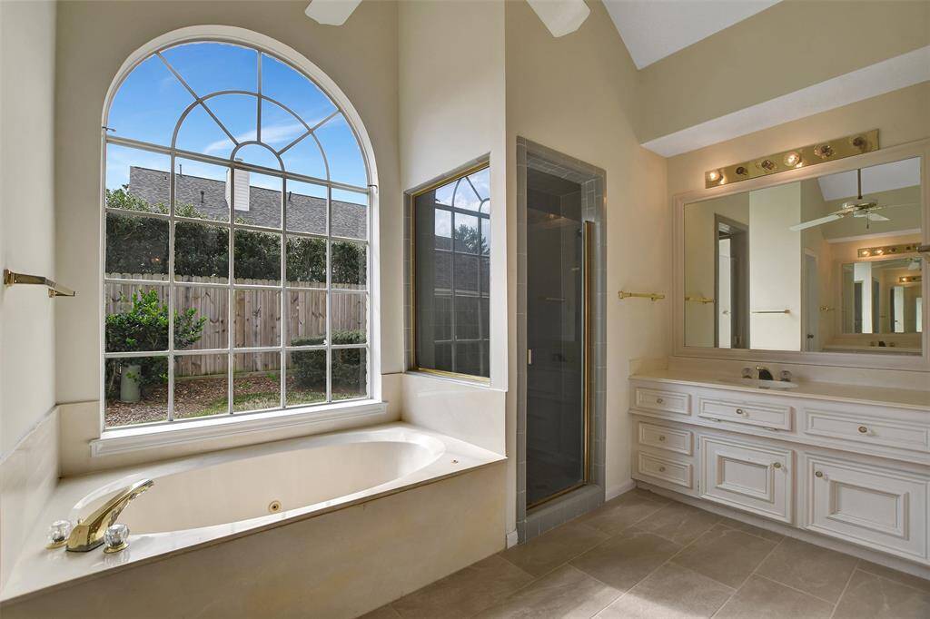 Primary bathroom with separate sinks.