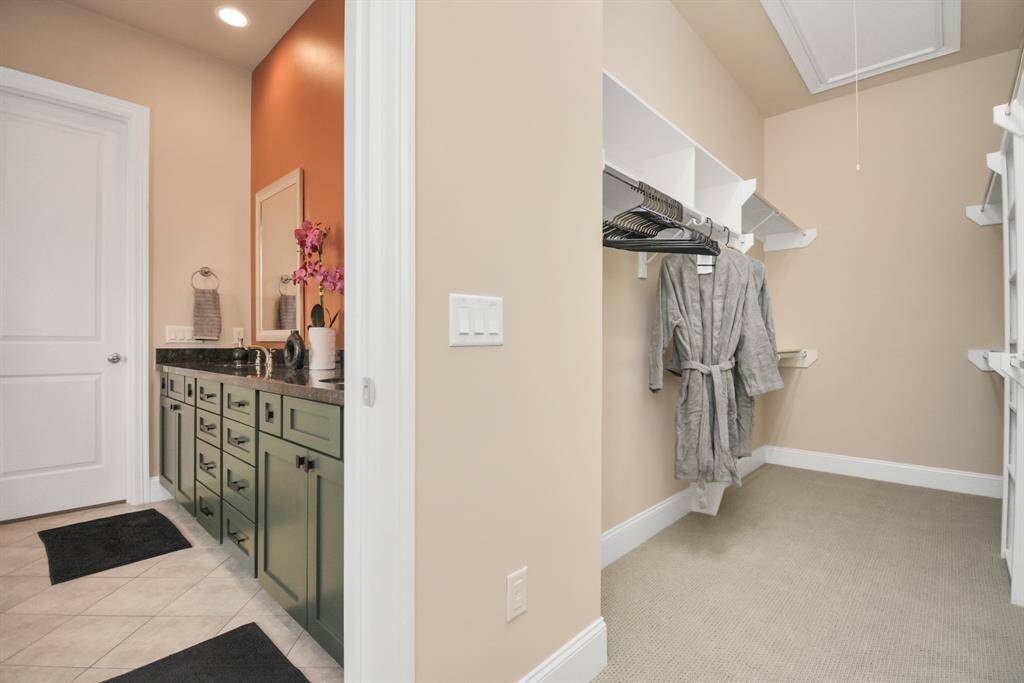 Master bath leads into massive walk-in closet
