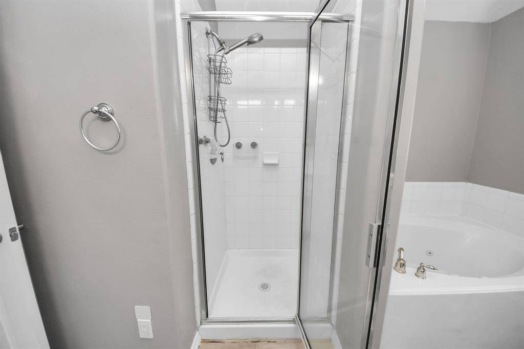 Primary bathroom has a separate shower and tub.