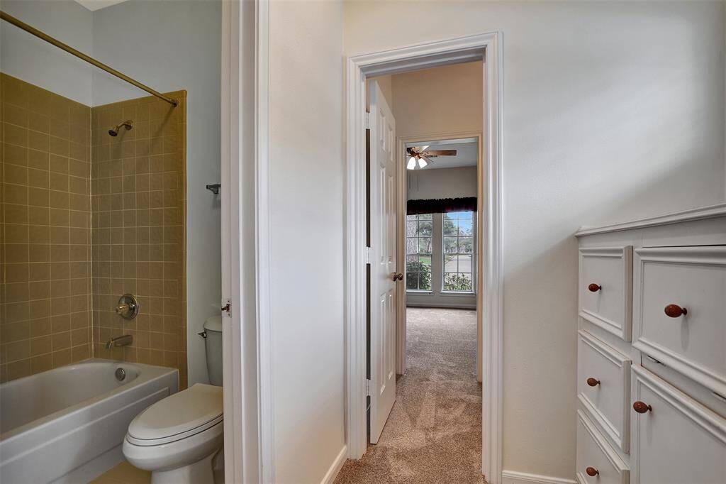 Jack & Jil bathroom between bedrooms with built-in storage.