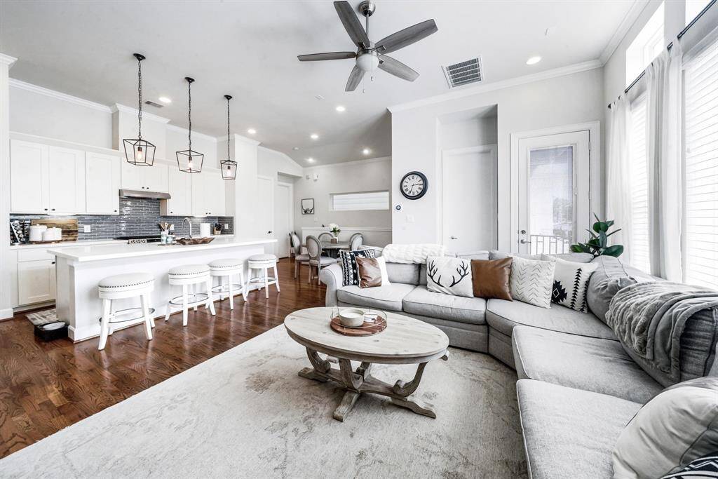Open concept living area with plenty of natural light and access to balcony.