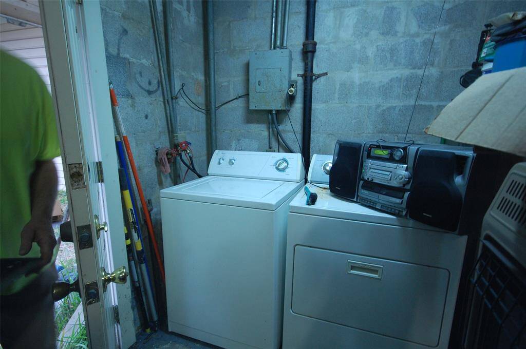 Washer and dryer for the garage apartment.  They are located downstairs in the garage.  The water heater is also located downstairs.