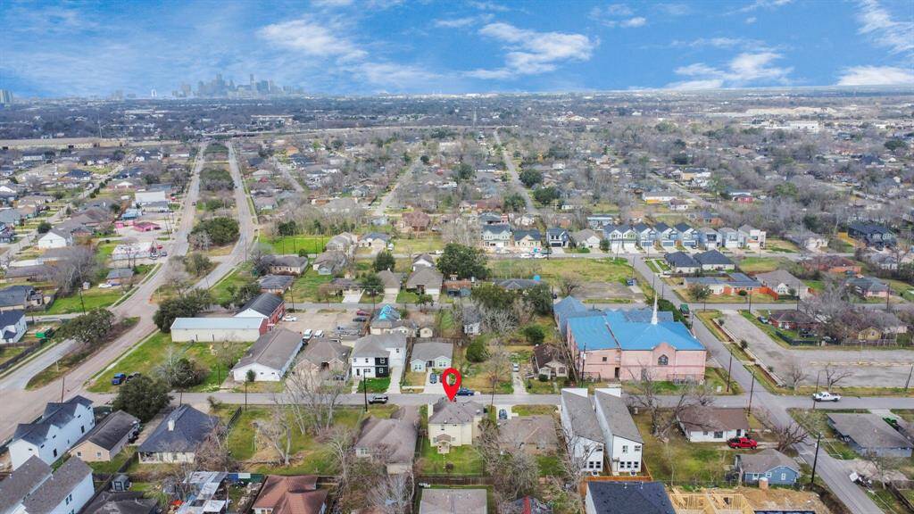 Suburban neighborhood with neatly arranged houses, tree-lined streets, and ample green spaces. Proximity to amenities while maintaining a residential feel.