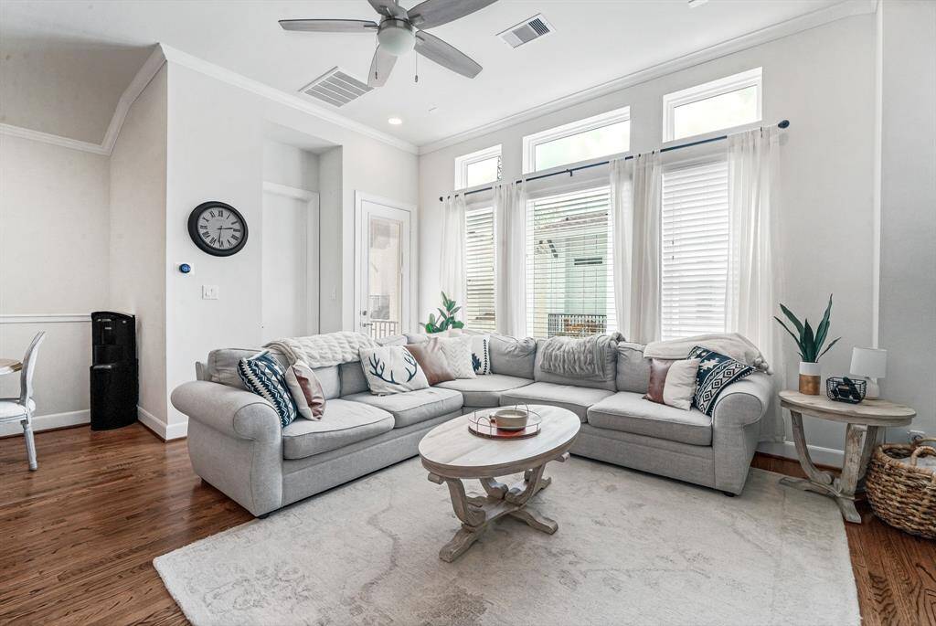 Open concept living area with plenty of natural light and access to balcony.