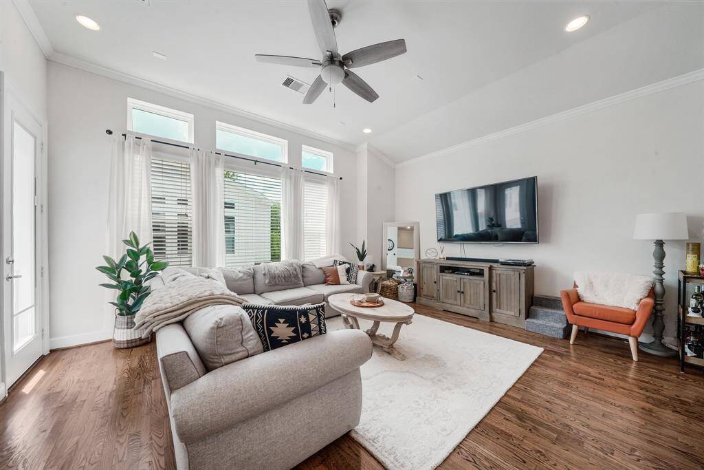 Open concept living area with plenty of natural light and access to balcony.
