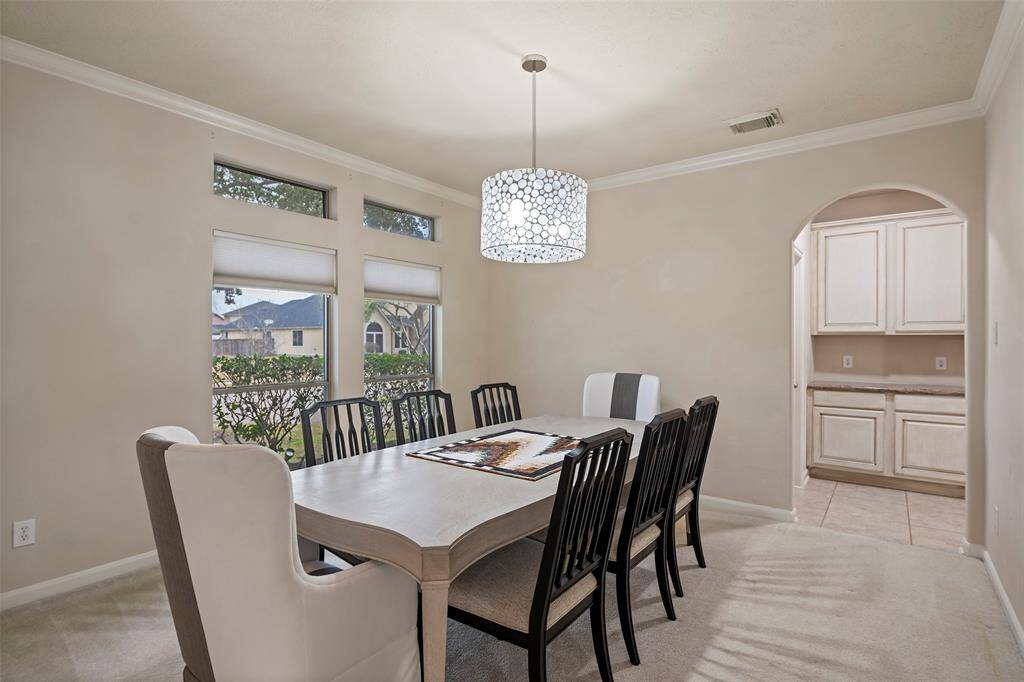 Formal dining area provides views of Taylor Lake.