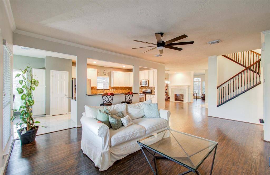 Family room with kitchen granite bar open to the family area.