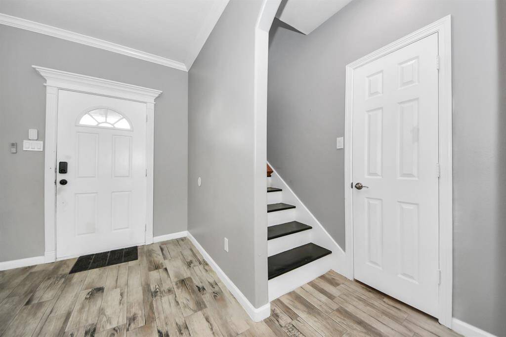 A clean and inviting entryway with simple, elegant finishes invites you into the home.