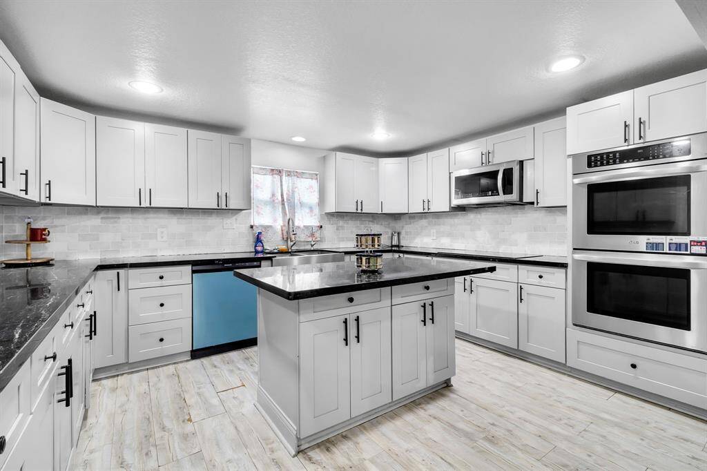 Fully remodeled with expansive counter space and modern finishes, ideal for entertaining.