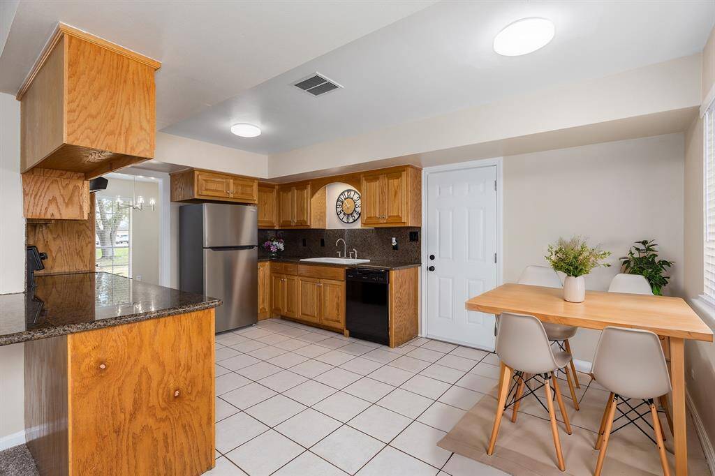 Bright kitchen with a cozy breakfast nook, perfect for morning coffee and casual dining.