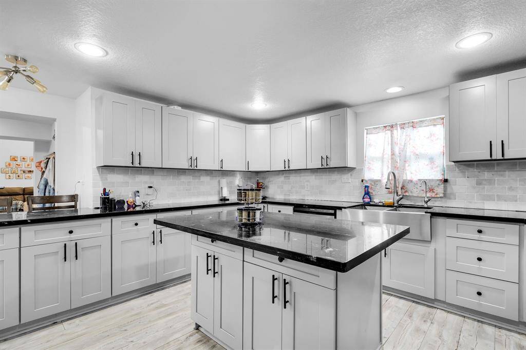 Fully remodeled with expansive counter space and modern finishes, ideal for entertaining.