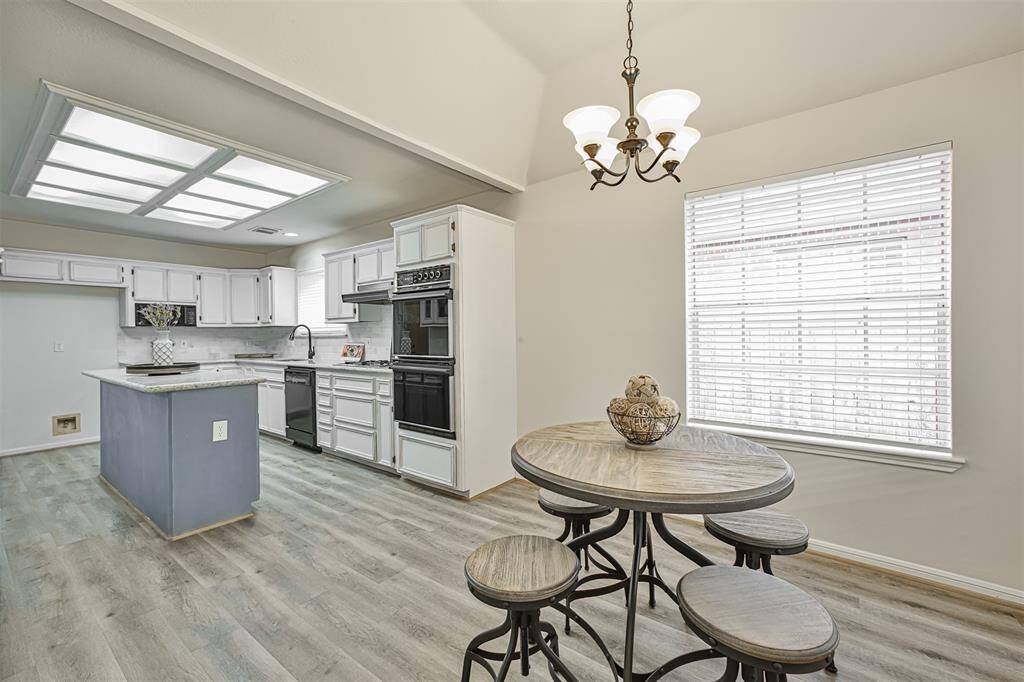 Farm sink, double ovens, and a multitude of cabinets and drawers will delight the chef in your family.