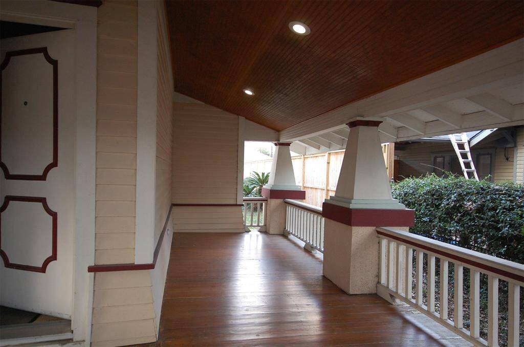 Gleaming hardwood floor on the porch goes well with the beautiful bead-board beaming above all.