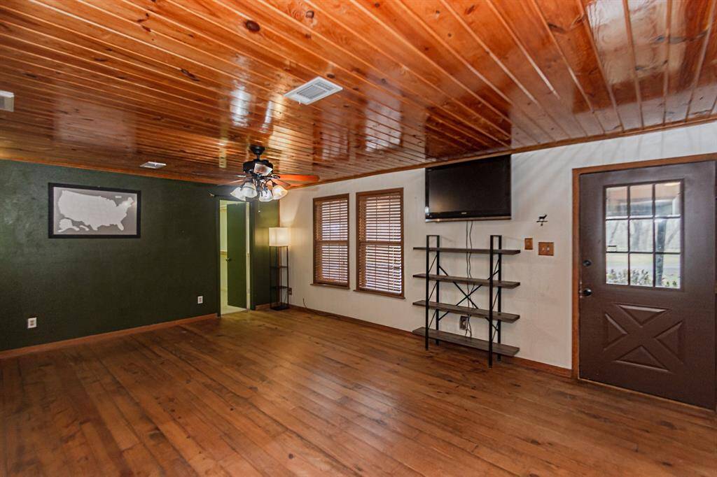 Bedroom one with door to front porch.