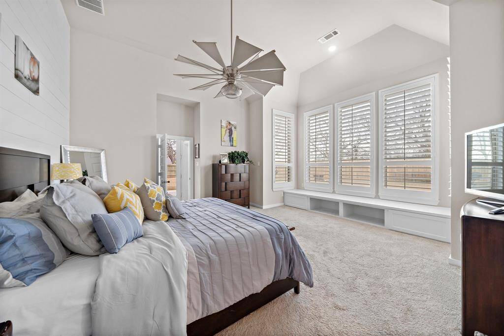 Extended master suite with custom built-in storage & luxurious bathroom with freestanding tub.