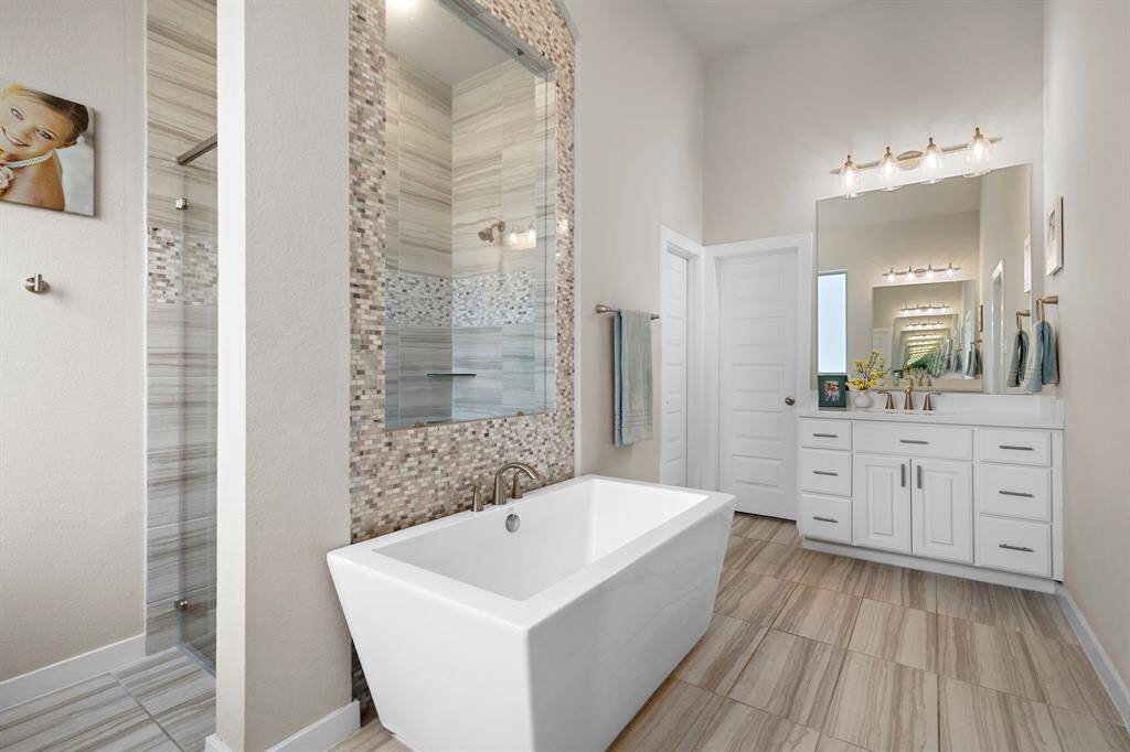 The luxurious en-suite bathroom boasts a freestanding tub giving the spa like feel.