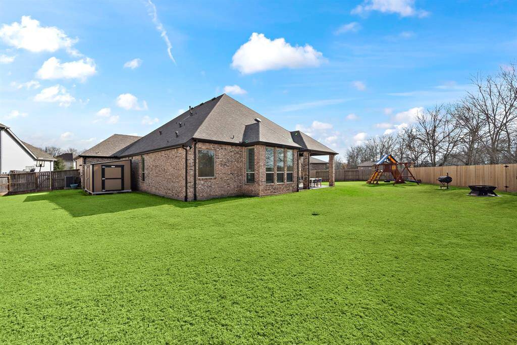 The massive backyard offers endless potential to create your own personal oasis.