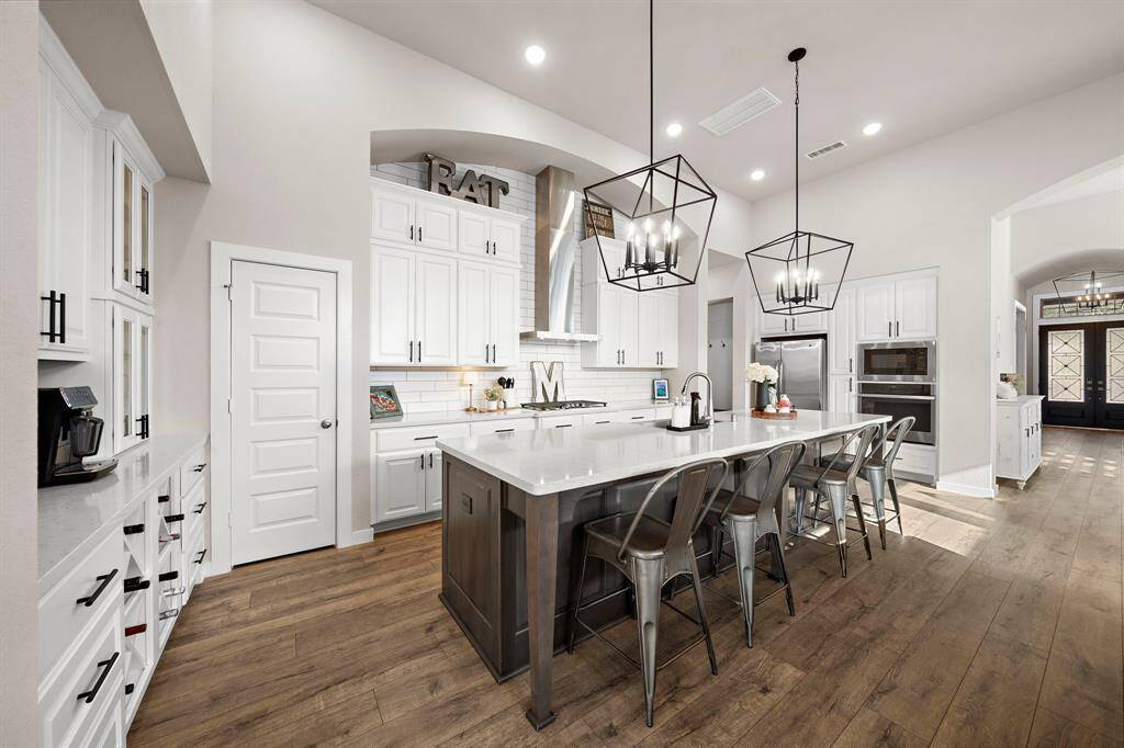 This stunning Highland Homes one-story is situated on a sprawling 0.36-acre cul-de-sac lot and boasts an impressive 4-car garage!