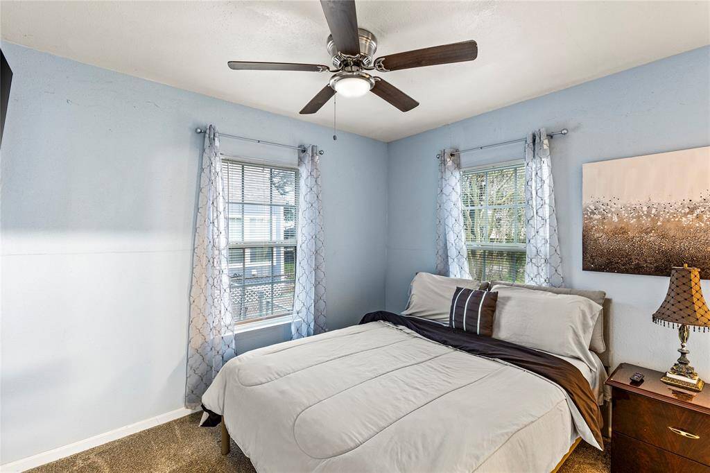 Primary bedroom with ensuite bathroom and walk in closet