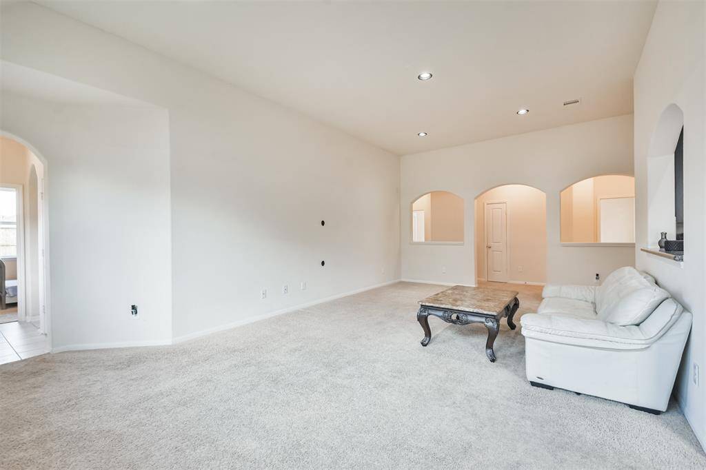 A welcoming family room providing access to the secondary bedrooms.