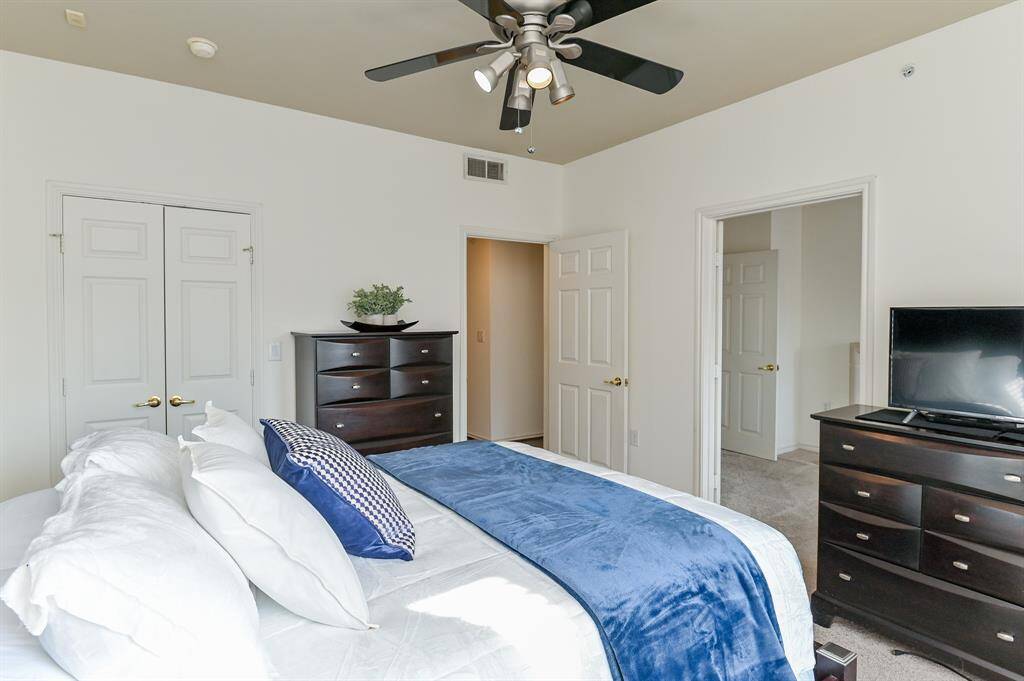 This oversized bright and airy chamber is complimented by a walk-in closet.