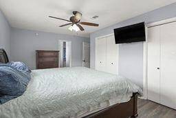 Second view of primary bedroom.