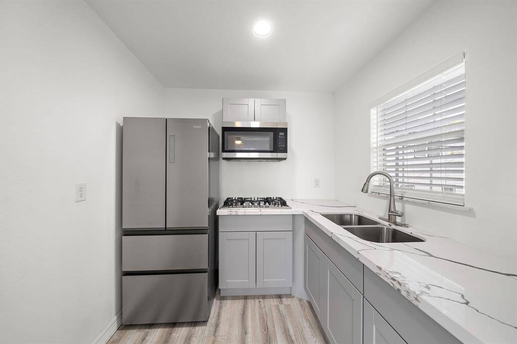 The garage apartment kitchen with new appliances.