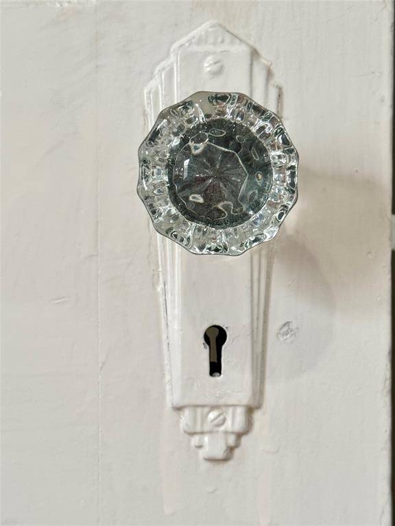 The vintage glass door knobs are so elegant