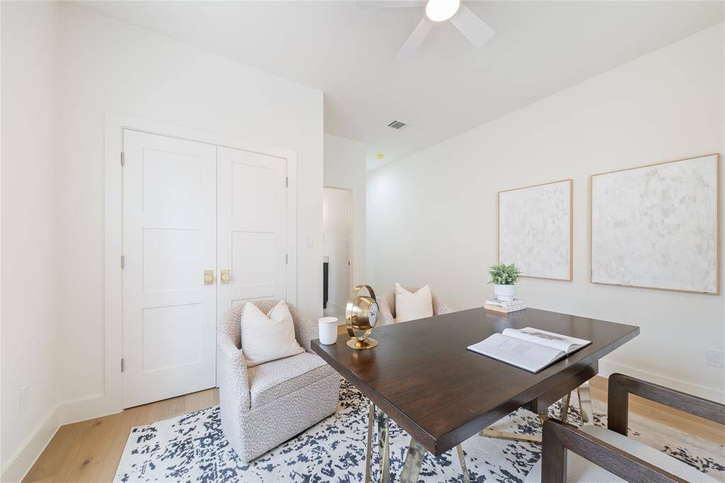 A flexible space featuring classic wainscoting, rich hardwood floors, and a peaceful ambiance—ideal as a bedroom or an inspiring home office.”