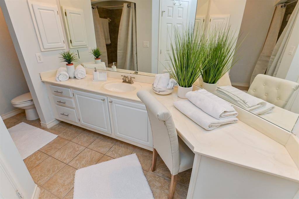 A vanity area provides additional space to place makeup, lotions, etc.