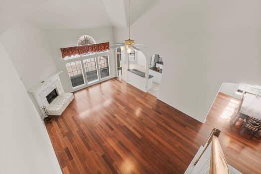 Formal living and dining room area with beautiful wood floors and treyed ceilings