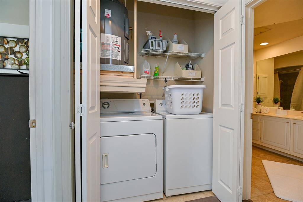 The utlity area is located outside the master bedroom.