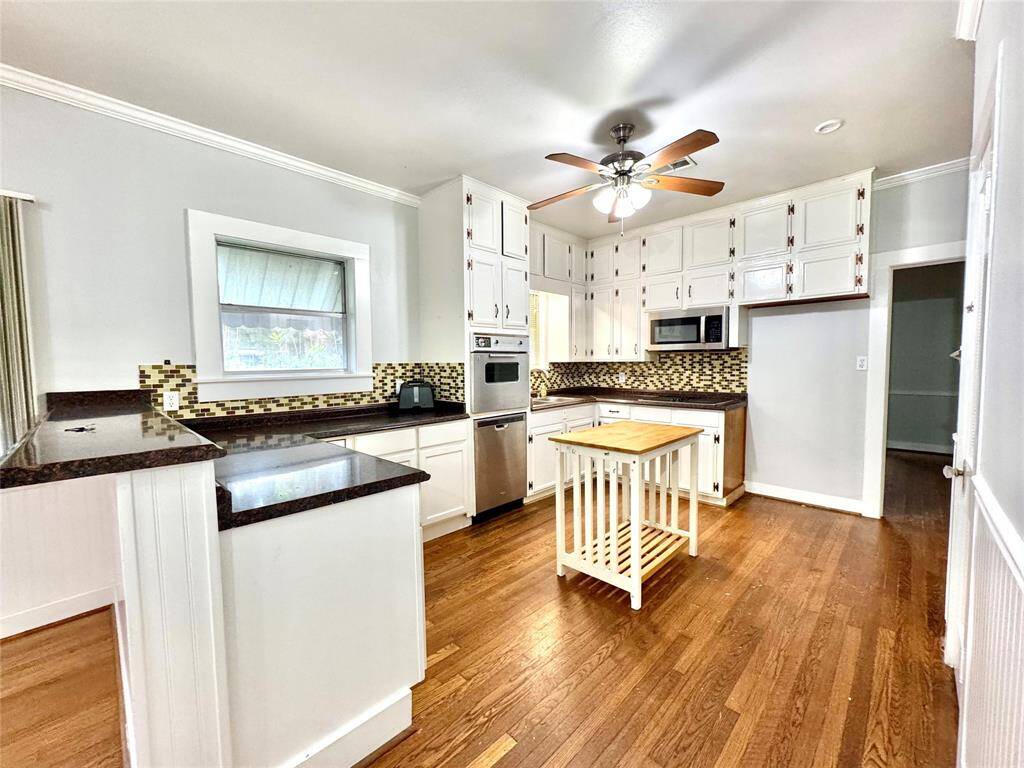Lovely spacious kitchen with view out to driveway to see when guests arrive