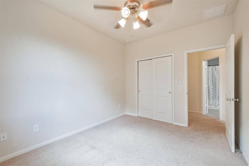 Bedroom #3 features raised panel sliding French doors.