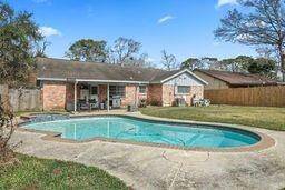 Nice large backyard w/heated hot tub.