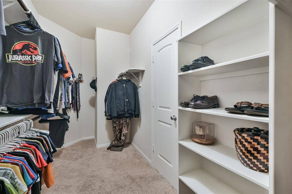 Spacious primary walk-in closet