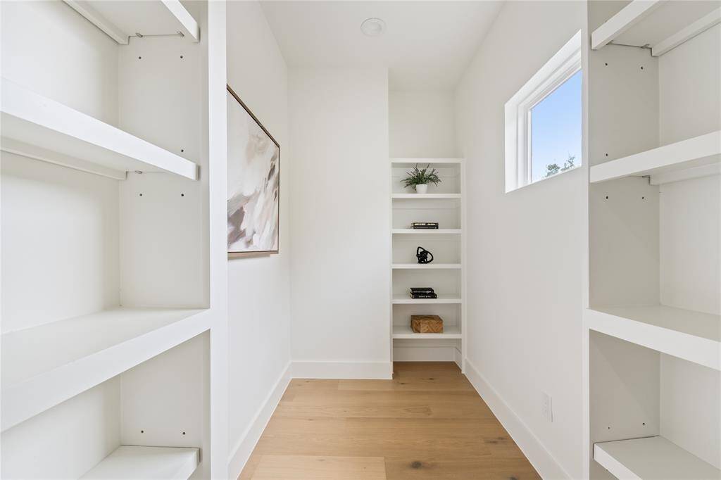 Tucked away for a touch of mystery and practicality, this hidden closet blends seamlessly into the design, offering discreet yet valuable extra storage.