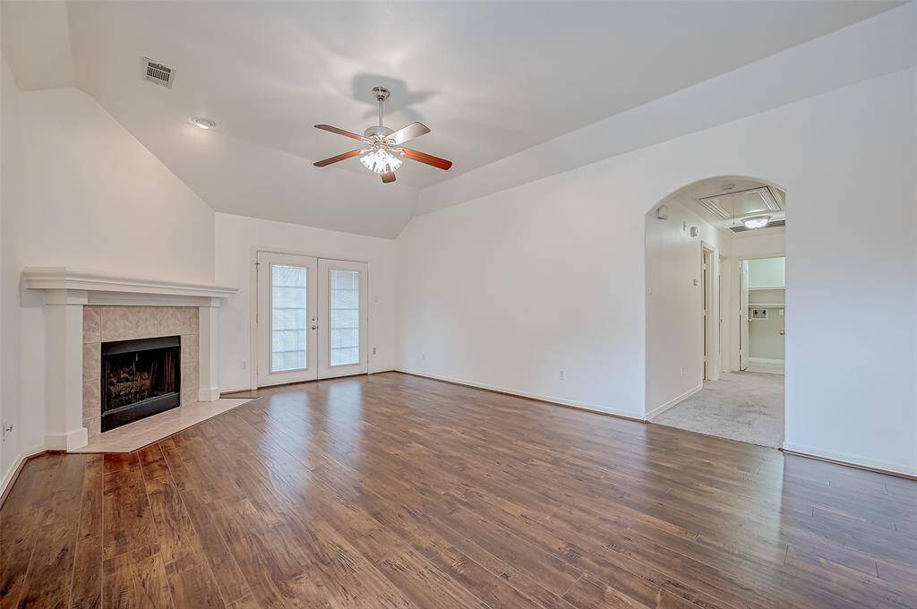 Ceilings with softly curved edges add dimension to this spacious living area.