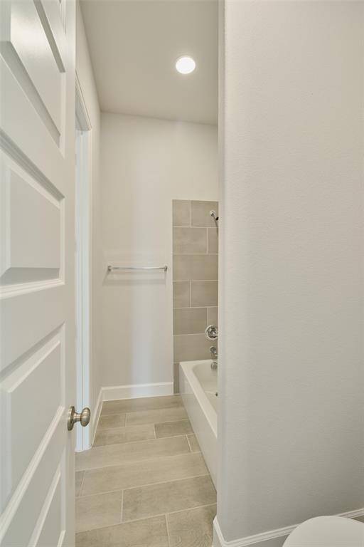 Tile floors throughout and upgrade shower surround with same tile is just one of the added features that make this a special home!  136 Hushed Nightfall, The Woodlands Hills.  Willis, TX.  77318.