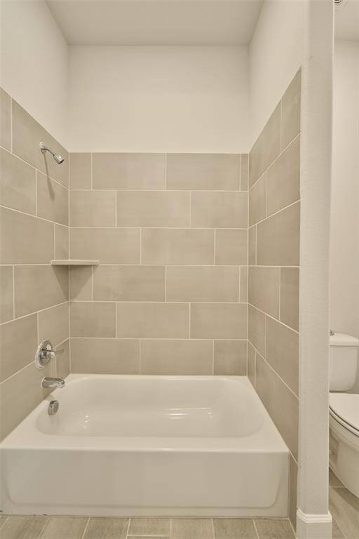 Tile surrounds the Bath/Shower combo in this 'Multi-Gen' style setup with Bedroom 4 at 136 Hushed Nightfall.