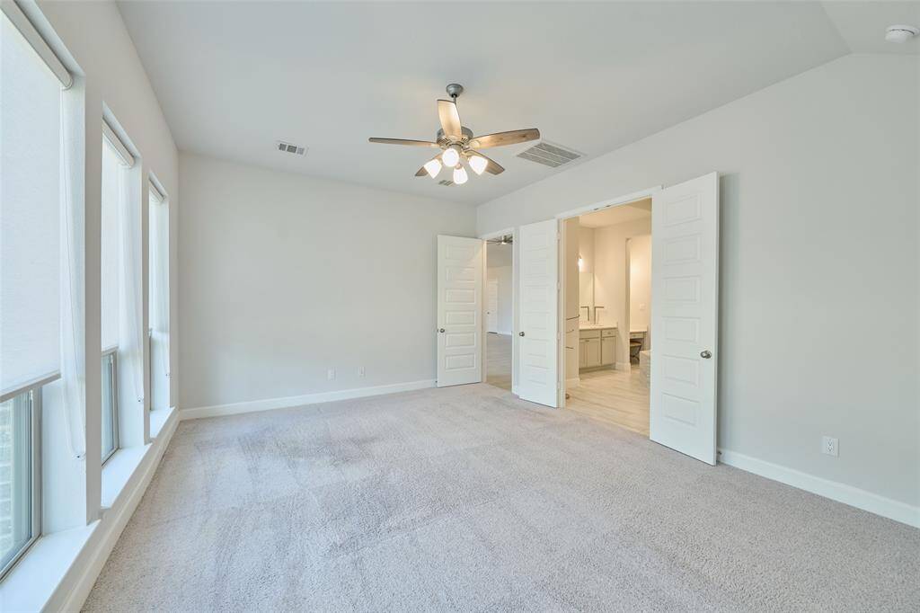 Primary Bedroom with Ensuite bath. Schedule your tour today at 136 Hushed Nightfall, The Woodlands Hills, Willis, Tx