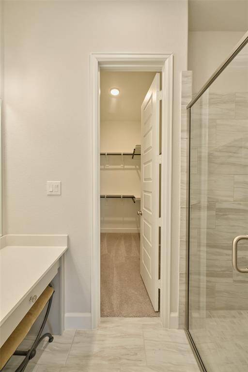One side-- highliting one of the 2 closets in the Primary Bath and easy shower access at 136 Hushed Nightfall.