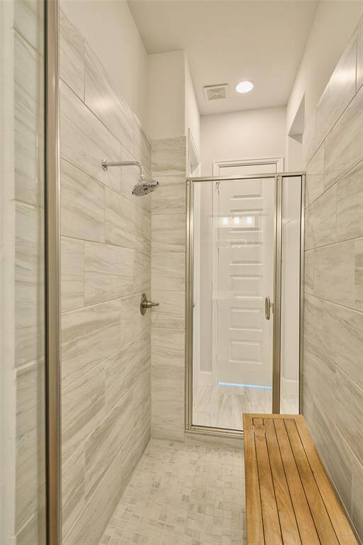 Surprise!  TWO entrances to this walk-in shower at 136 Hushed Nightfall!