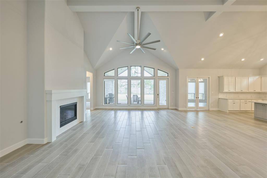 True Open Concept with vaulted ceilings allows for your Imagination to create the perfect home gathering space. Laundry and Storage is conveniently centrally located in this 3311st home. Check out the next photo--your view beyond... Schedule your tour today at 136 Hushed Nightfall, The Woodlands Hills, Willis, Tx