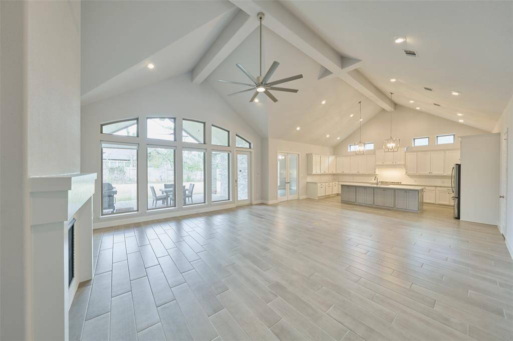 Vaulted Ceilings, Wall of windows and 'to-be-envied' amount of kitchen storage space.  The glass doors next to kitchen lead to a spacious gameroom.