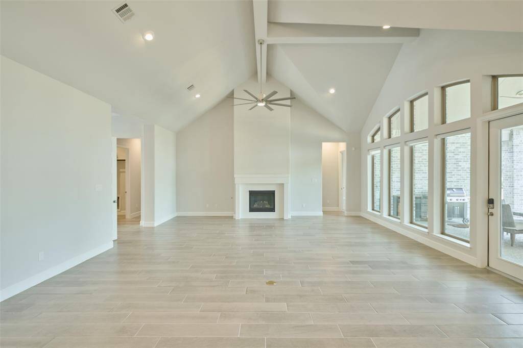 The fireplace creates a beautiful centerpiece of the home at 136 Hushed Nightfall.